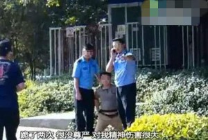 深圳市民拍警车违章被民警摔跪 涉事民警停职(图)